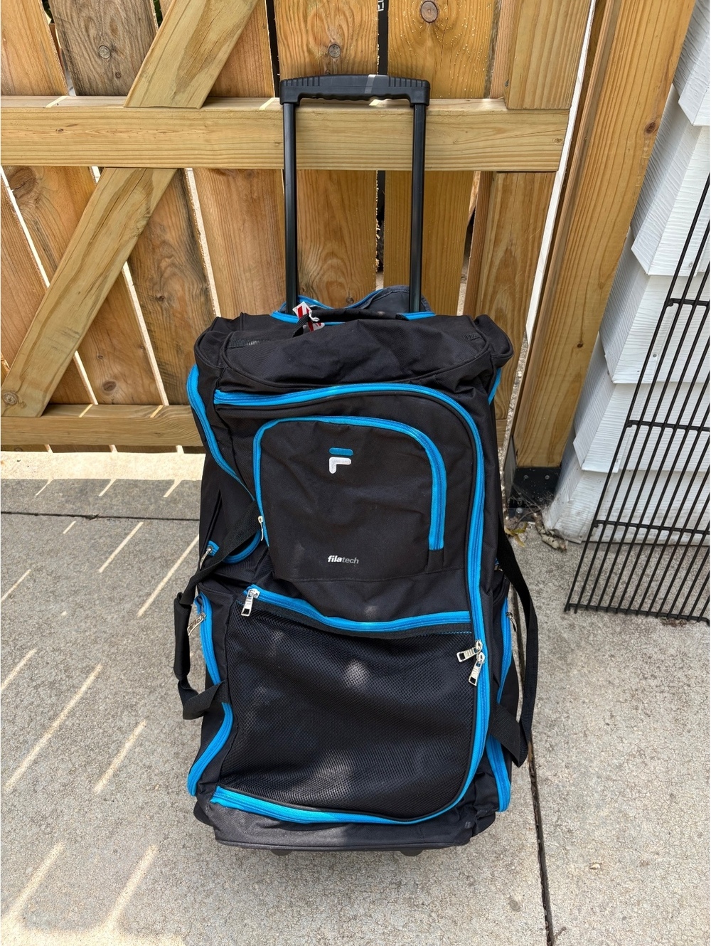 Fila Black and Blue Rolling Duffel Bag with Multiple Compartments